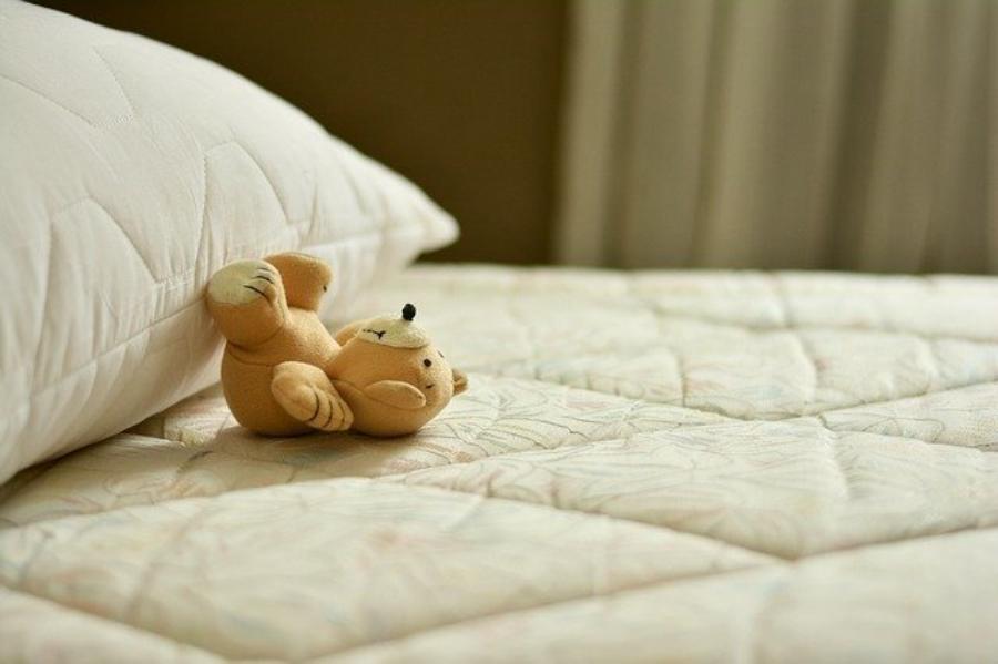 teddy bear on a mattress